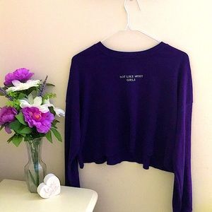 Cropped long sleeve “Not Like Most Girls” purple